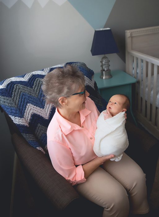 Three-generation family portrait during a New York City in-home newborn session