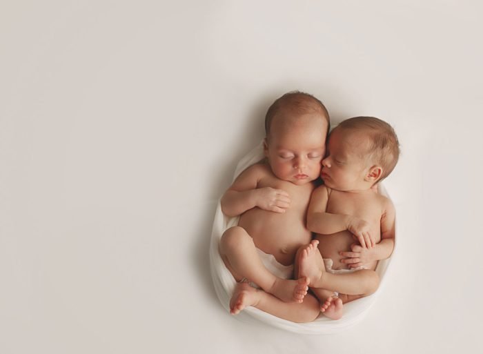 Newborn photography in a New York City apartment with neutral styling with twins