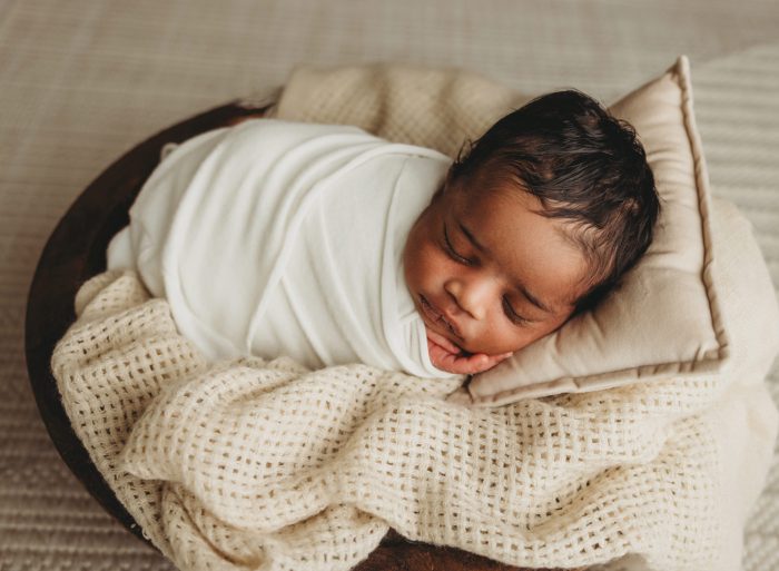 In-home newborn session capturing baby boy in New York City