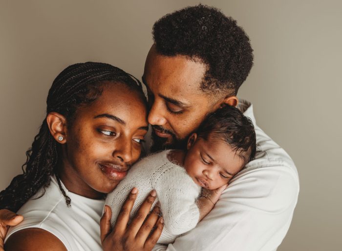 ntimate family newborn photo of parents and baby boy in New York City