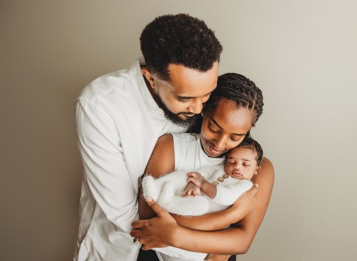 Emotional newborn family portrait with baby boy in NYC home