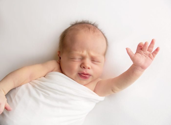 Newborn baby photographed at home in New York City during an in-home session