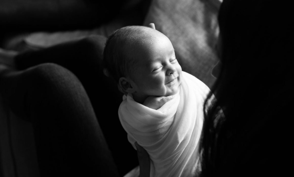 Organic newborn photography session in NYC focused on natural moments