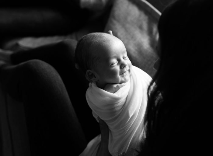 Organic newborn photography session in NYC focused on natural moments