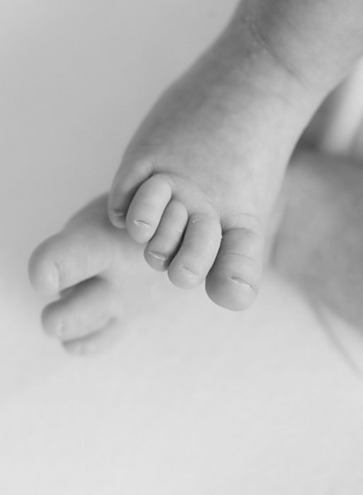 Newborn photography session in Manhattan featuring soft, neutral tones
