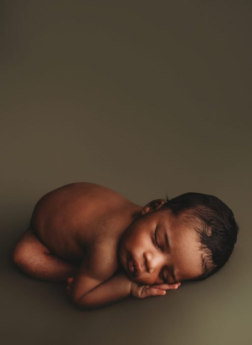 Luxury NYC newborn photography of baby boy peacefully sleeping